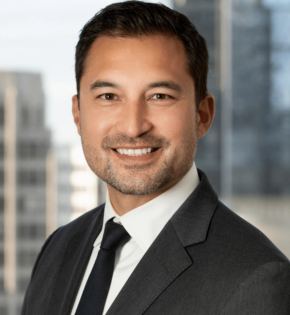 Professional headshot of Chandler Udo, Partner at Oslund Udo Little